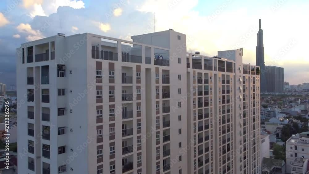 Timelapse of ho chi minh city skyline with apartment block in the foreground Timelapse of ho chi minh city skyline with apartment block in the foreground