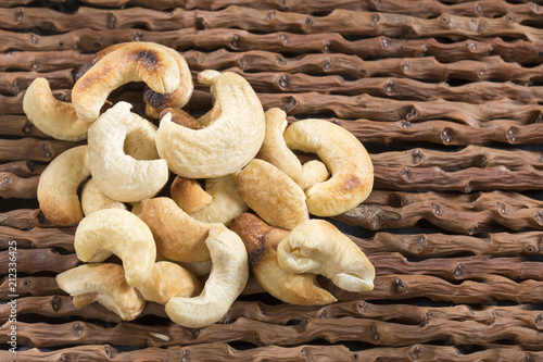 Salted cashews - Wooden background. Anacardium occidentale photo