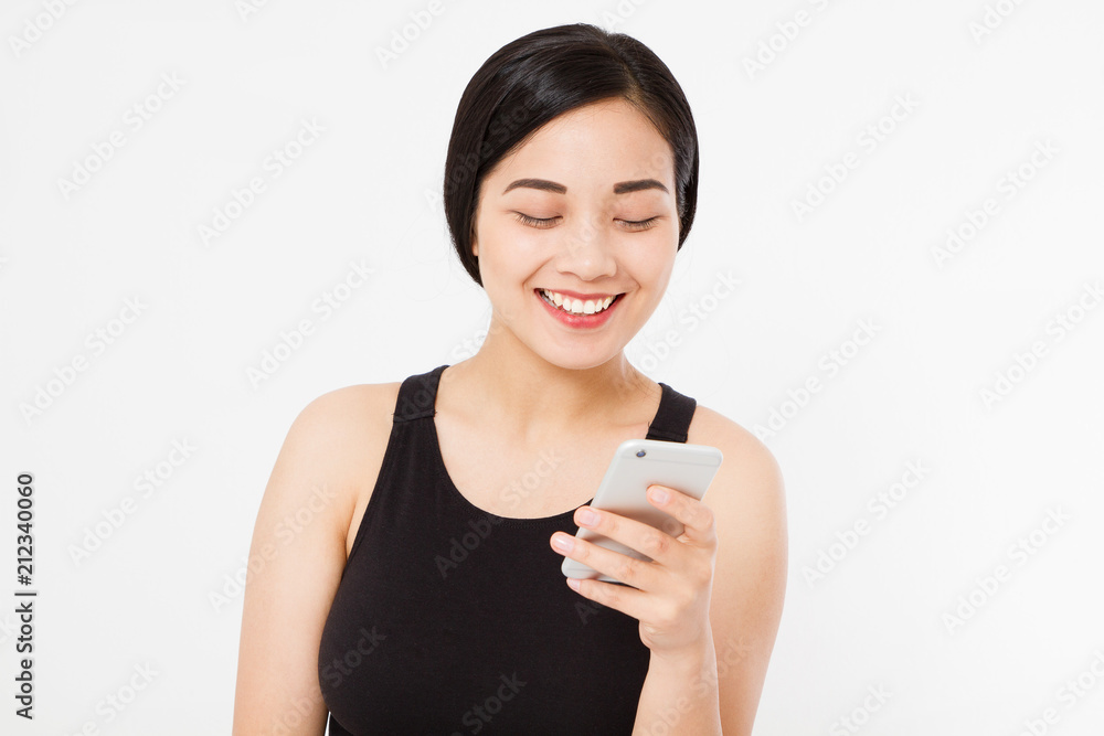 smiling woman hold cellphone. Closeup young happy beautiful asian japanese woman. Girl looking at mobile cellphone isolated on white background. Positive face expression human emotion. Copy space. smiling woman hold cellphone. Closeup young happy beautiful asian japanese woman. Girl looking at mobile cellphone isolated on white background. Positive face expression human emotion. Copy space.