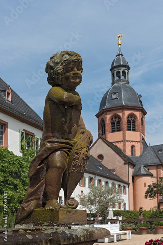 Putto in the monastery garden of the church of St. Marcellinus and Peter in Seligenstadt, Germany photo