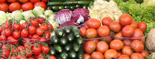 fresh tomatos and other vegetables for sale at local market