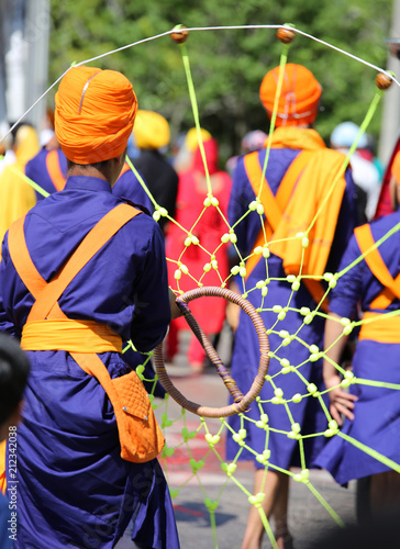 Sikhs with a traditional dress and a traditional game photo