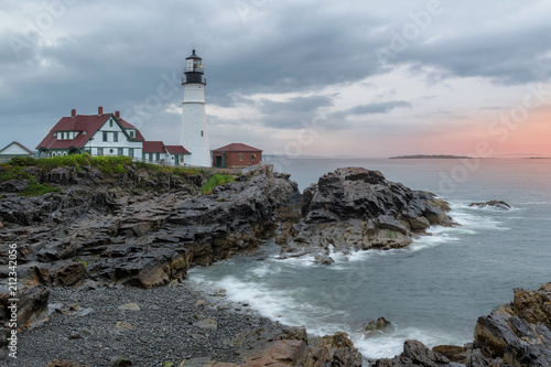 The Portland Lighthouse at sunrise in cloudy summer dayt in Portland, Maine, USA.
