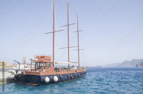 Wooden ship for trip in port on Santorini island