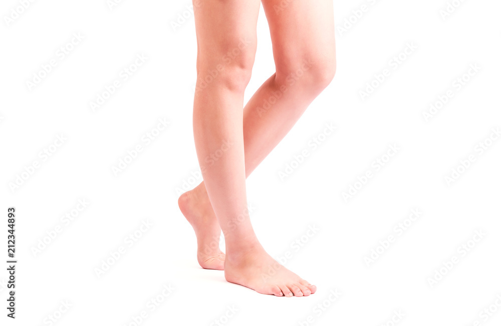 Side view of a beautiful naked legs of a woman walking isolated on a