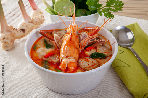 Tom yam kong or Tom yum, Tom yam is a spicy clear soup typical in Thailand and No.1 Thai Dish Cuisine.