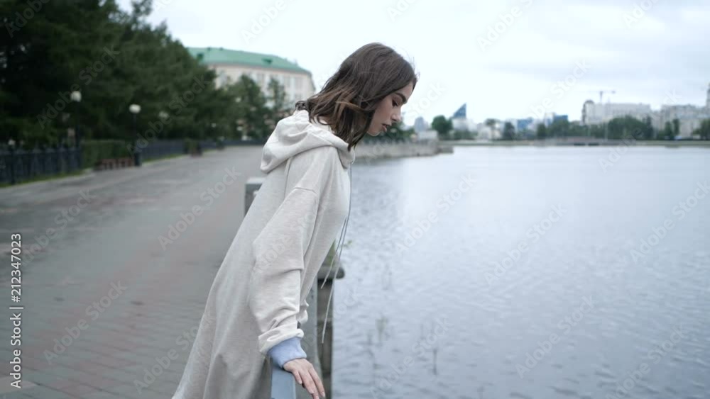 Girl is looking into the river Girl is looking into the river