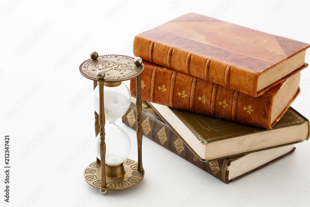 アンティークな本と砂時計 Stock Photo Adobe Stock