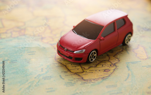 Travel and Transportation concept,Red miniature car on the map