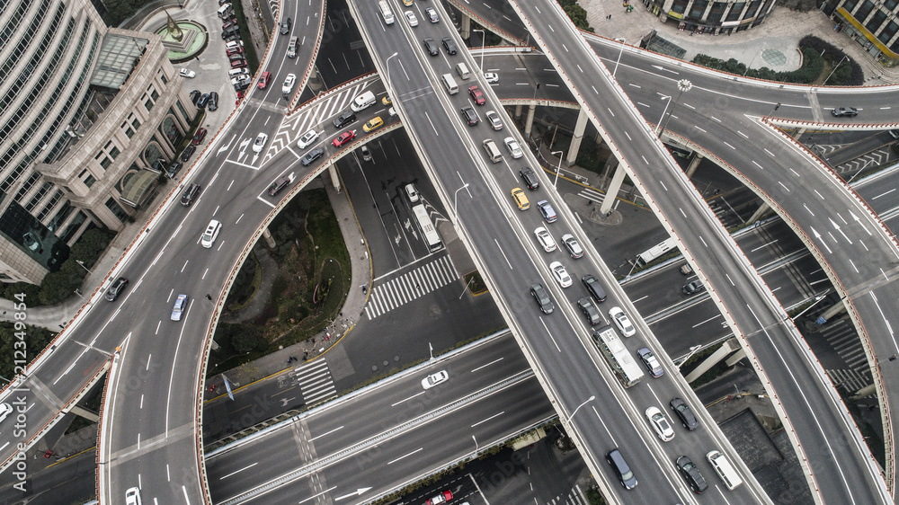 Aerial view of highway and overpass in city on a cloudy day