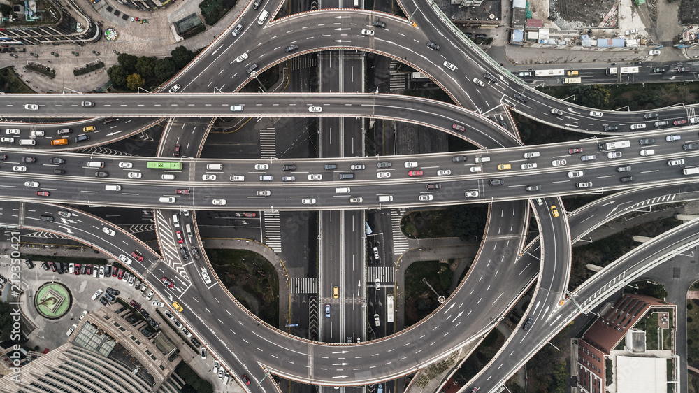 Aerial view of highway and overpass in city on a cloudy day Aerial view of highway and overpass in city on a cloudy day