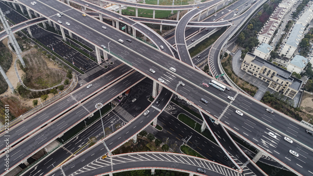 Aerial view of highway and overpass in city on a cloudy day Aerial view of highway and overpass in city on a cloudy day