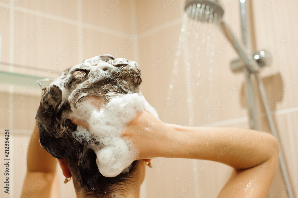 Beautiful naked young woman taking shower in bathroom Stock Photo Adobe Stock