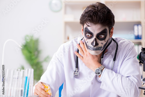 Scary monster doctor working in lab photo