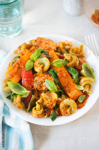 Red pesto chicken with spinach fusilli, seared red peppers and squash 