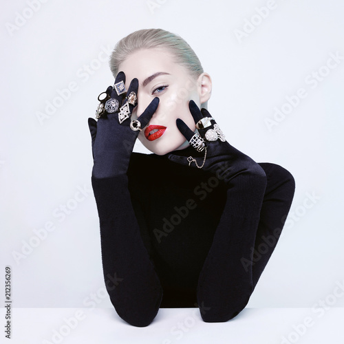 Beautiful blonde lady with lot of precious rings