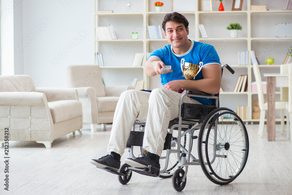 Disabled man watching sports on tv Disabled man watching sports on tv