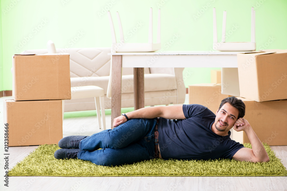 Man moving house with boxes Man moving house with boxes