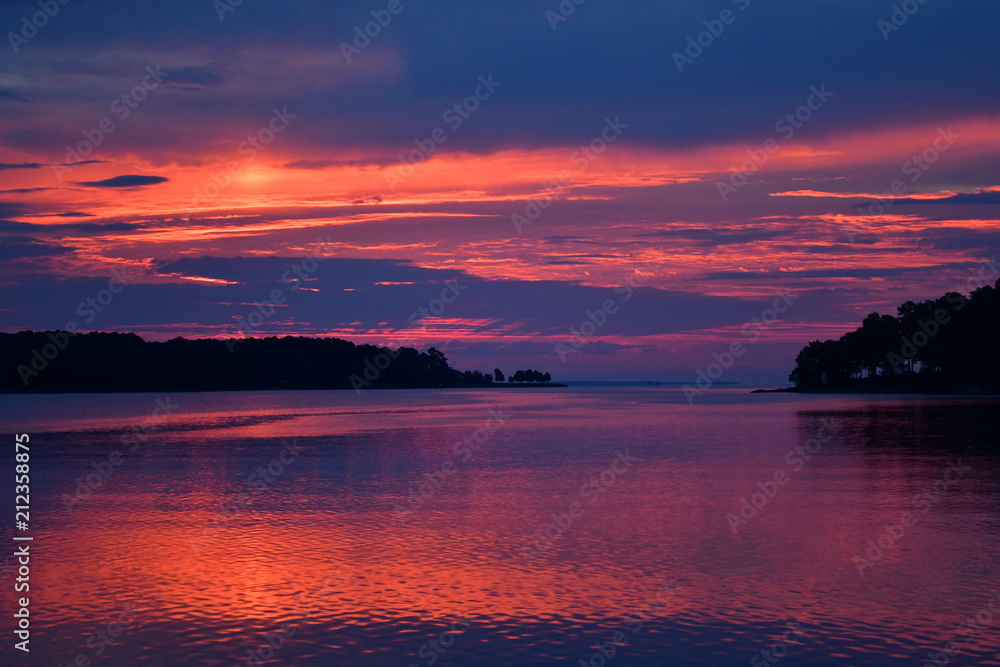Deep blue, purple, and orange sunrise over the Potomac River in Virginia