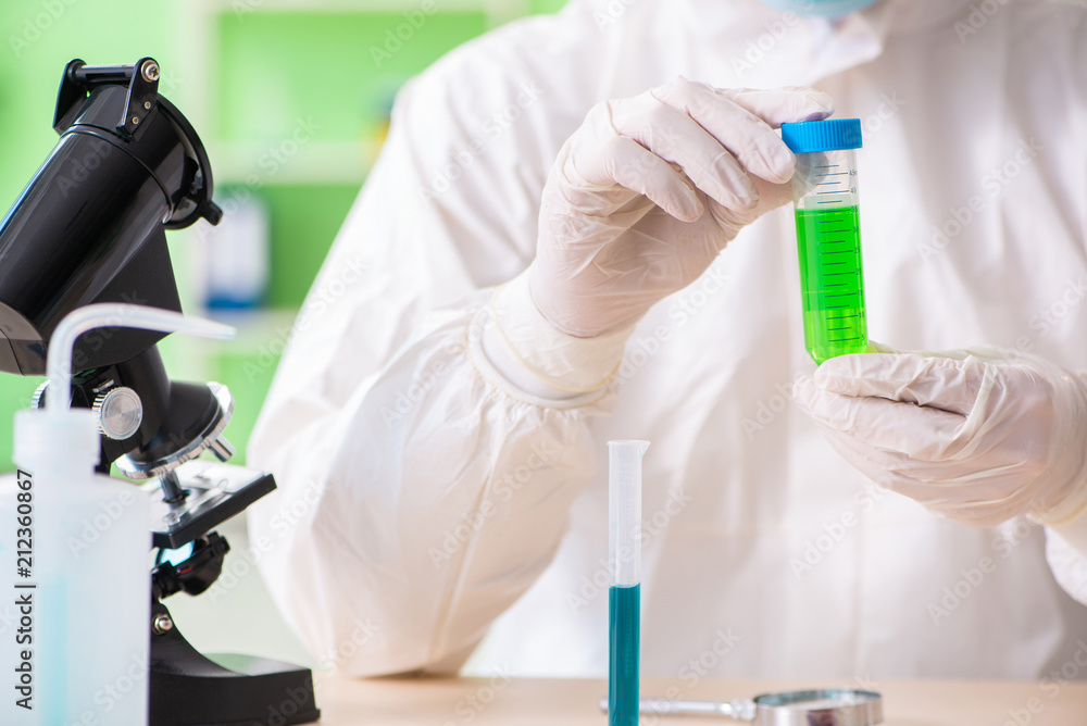 Chemist working in the lab on new experiment Chemist working in the lab on new experiment
