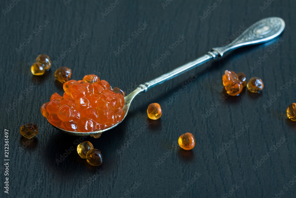 Red caviar in the silver spoon. Red caviar in the silver spoon.