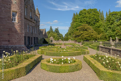 Gardens at Glamis Castle in Scotland. Glamis Castle is situated close to the village of Glamis in Angus. It is the home of the Earl and Countess of Strathmore and Kinghorne, and is open to the public. photo