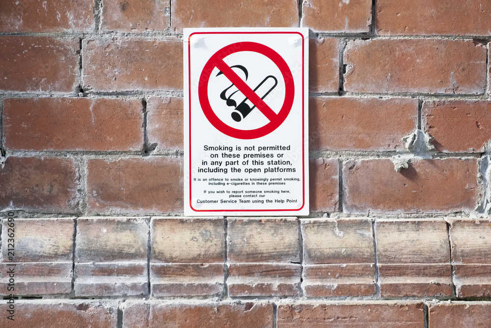 No smoking ban sign at train station prohibited railway line uk No smoking ban sign at train station prohibited railway line uk