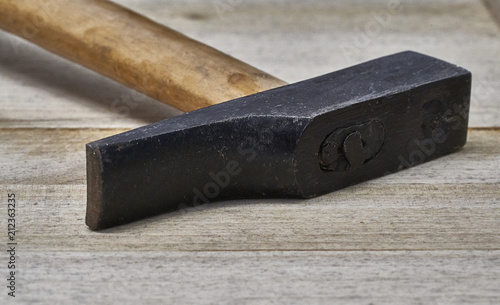 Hammer on a wooden table