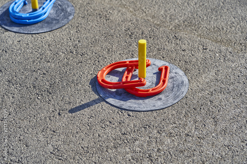 Horse shoes game in the asphalt