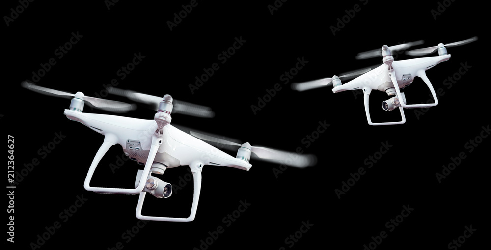 Isolated white drone with twirled propellers on black background - obrazy, fototapety, plakaty 