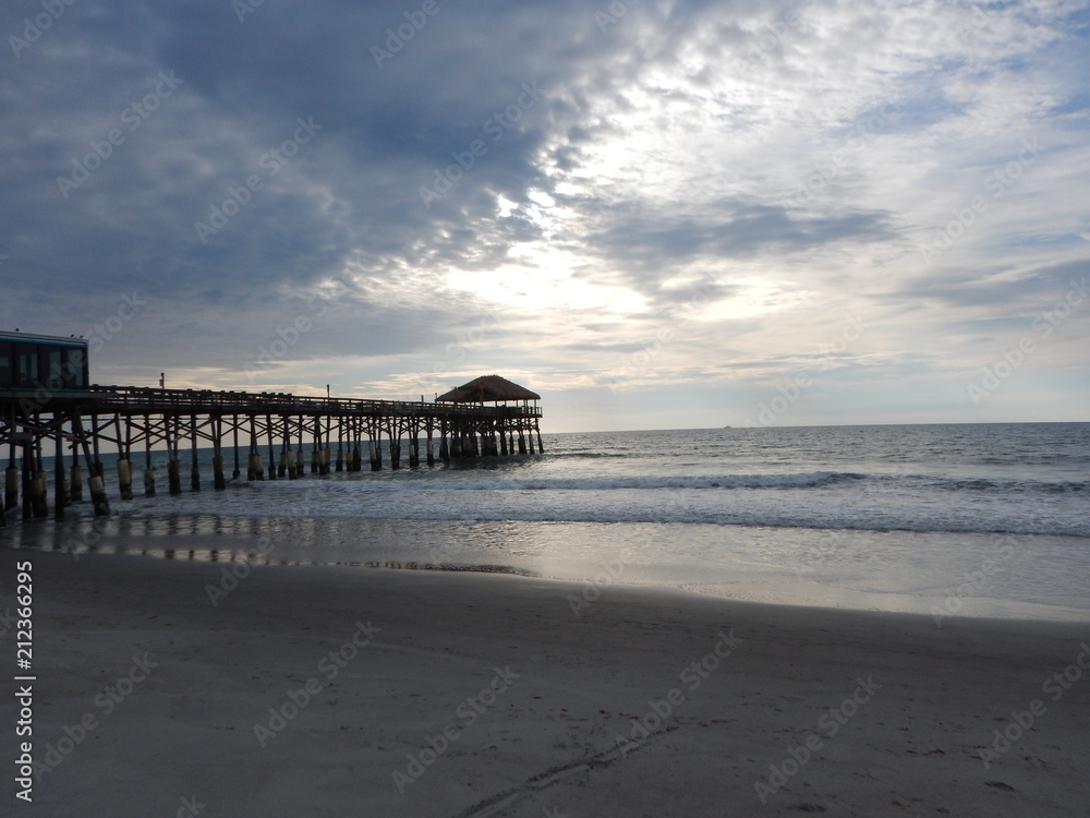 The view of Cocoa Beach Pier on a cloudy day on the beach in Florida