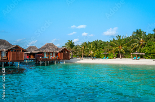 The perfect beach. Water bungalow. Luxury escape. Tropical paradise. Honeymoon at Maldives. Palms and white sund. Blue ocean 