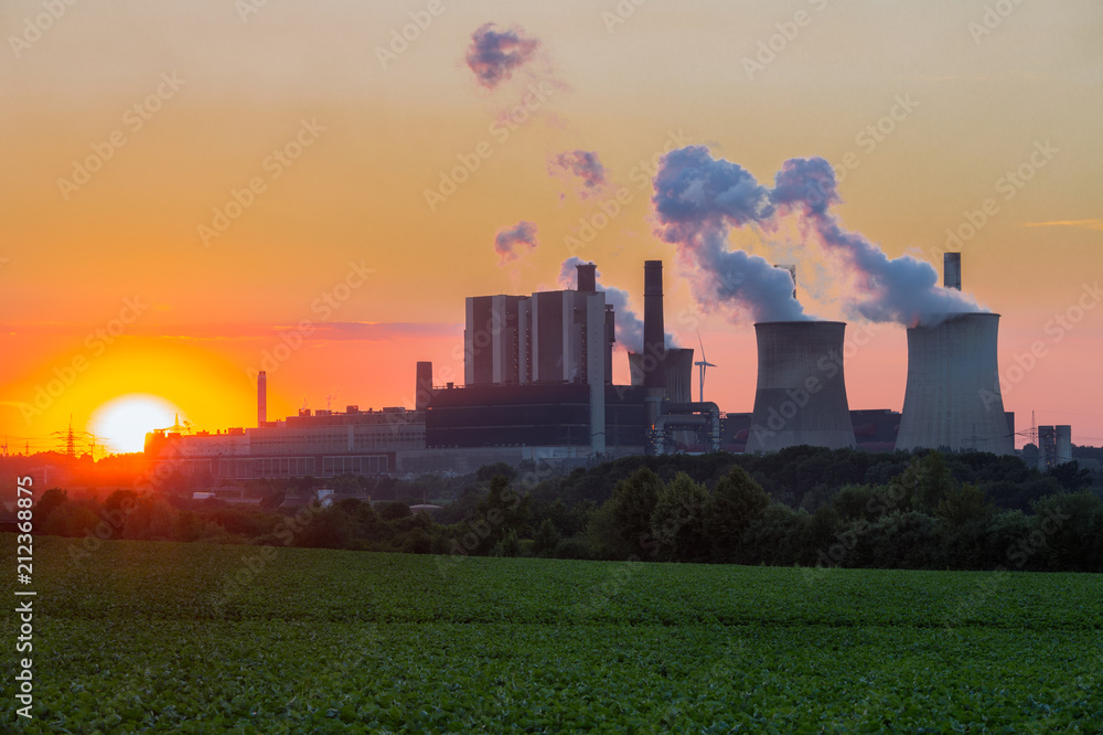 Sunset view at Coal-fired power plant near lignite mine Inden in Germany Sunset view at Coal-fired power plant near lignite mine Inden in Germany