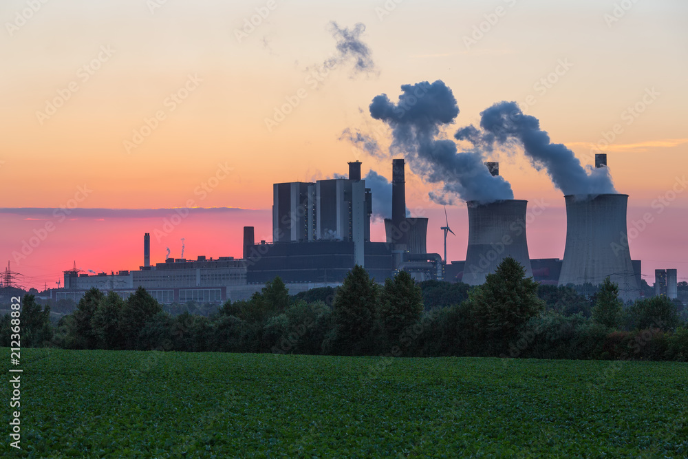 Sunset view at Coal-fired power plant near lignite mine Inden in Germany