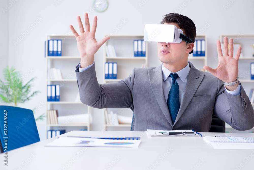 Businessman with virtual reality glasses in the office Businessman with virtual reality glasses in the office