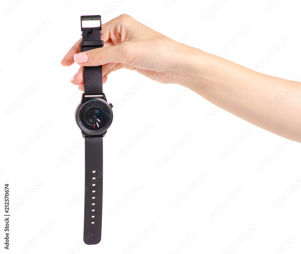 Female black watch on the hand of a rubber bracelet on a white background isolation Female black watch on the hand of a rubber bracelet on a white background isolation