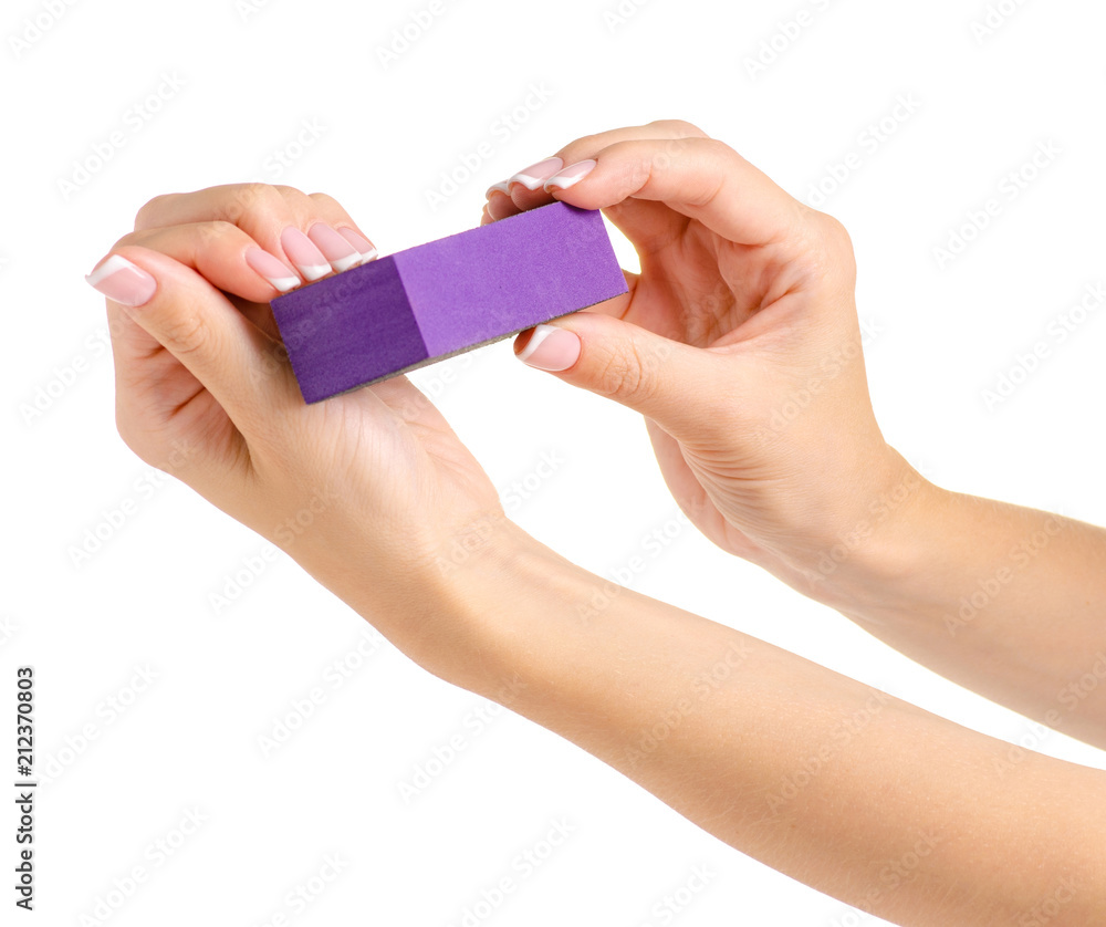 Female hand manicure nail buff on white background isolation Female hand manicure nail buff on white background isolation