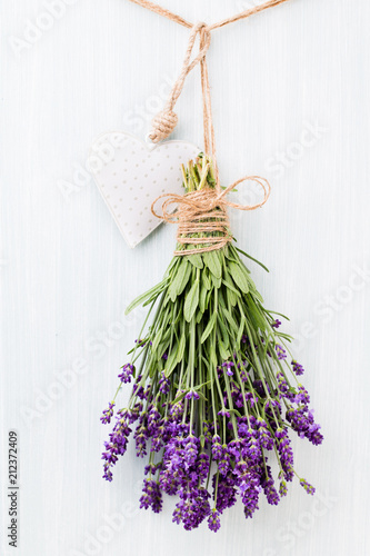 Fototapeta Naklejka Na Ścianę i Meble -  Lavender flowers, bouquet on rustic background, overhead.