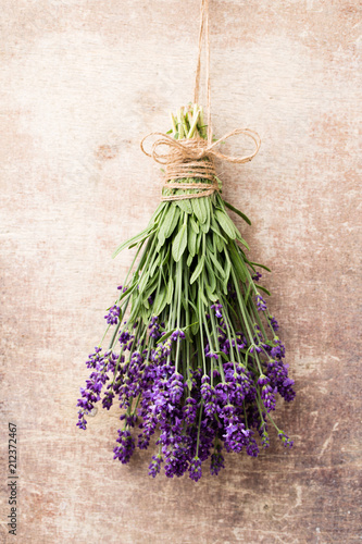 Fototapeta Naklejka Na Ścianę i Meble -  Lavender flowers, bouquet on rustic background, overhead.