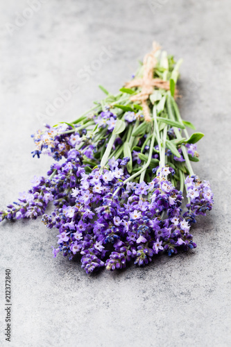 Fototapeta Naklejka Na Ścianę i Meble -  Lavender flowers, bouquet on rustic background, overhead.