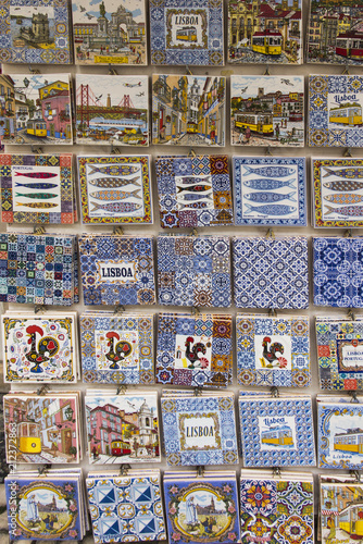 Traditionally decorated ceramic tiles for sale as souvenirs in front of a street shop in Lisbon