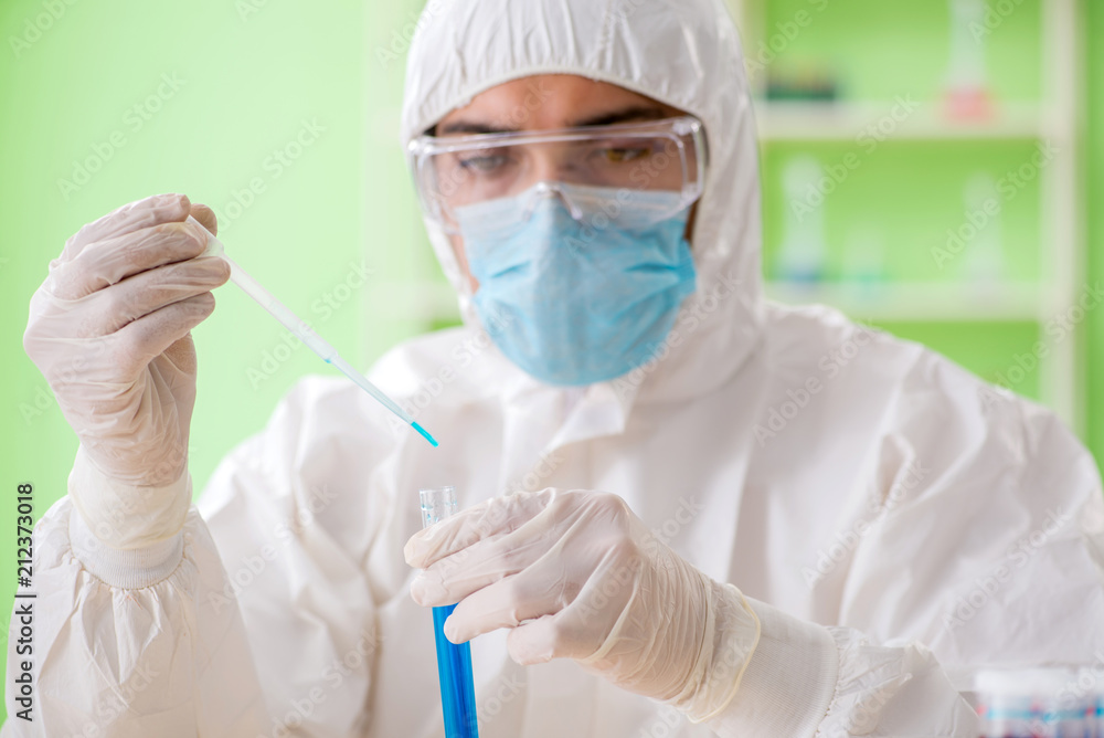 Chemist working in the lab on new experiment Chemist working in the lab on new experiment