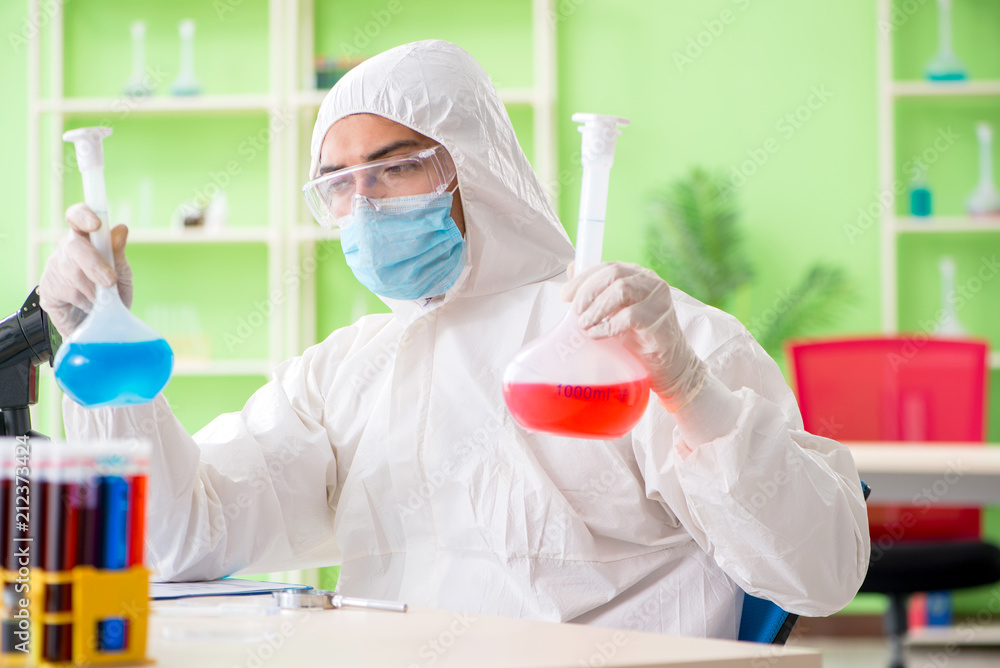 Chemist working in the lab on new experiment Chemist working in the lab on new experiment