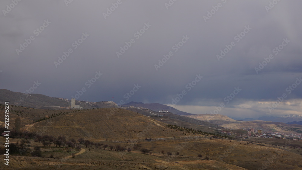 mountain and city mountain and city