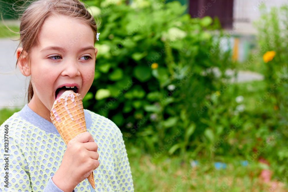 The child is eating ice cream. The child is eating ice cream.