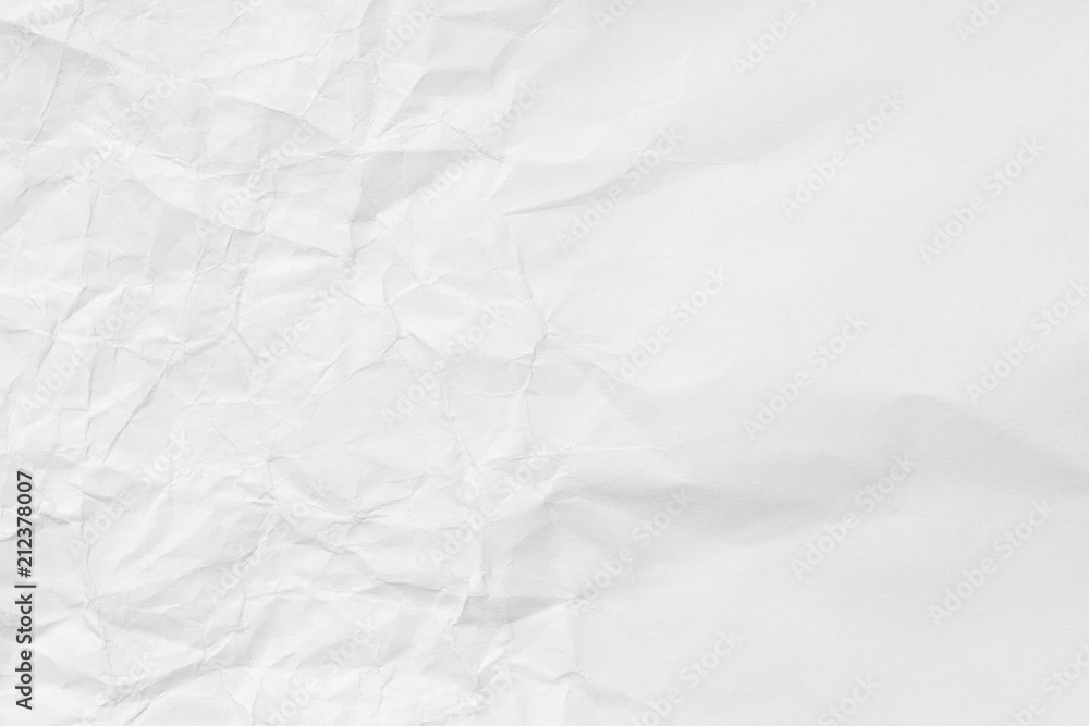 Fototapeta premium The texture of white paper with dents and kinks. Background of the rumpled surface.