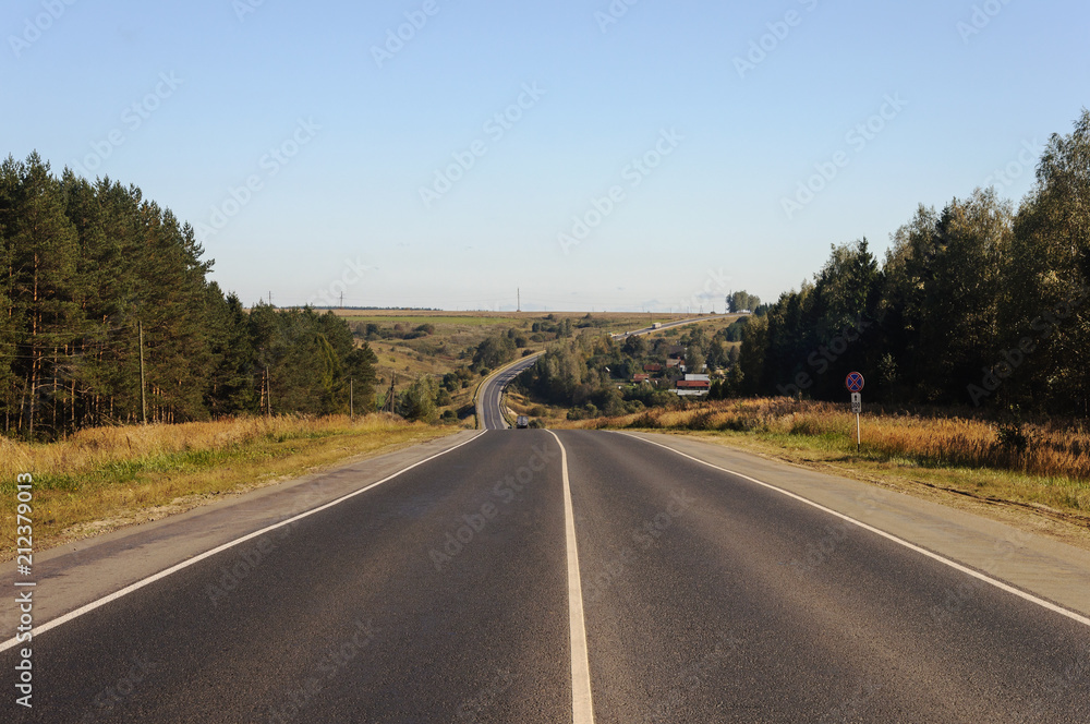 Asphalt road across the hills