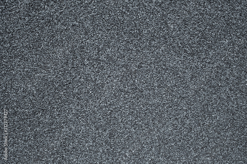 A wall covered with a stone crumb in gray color