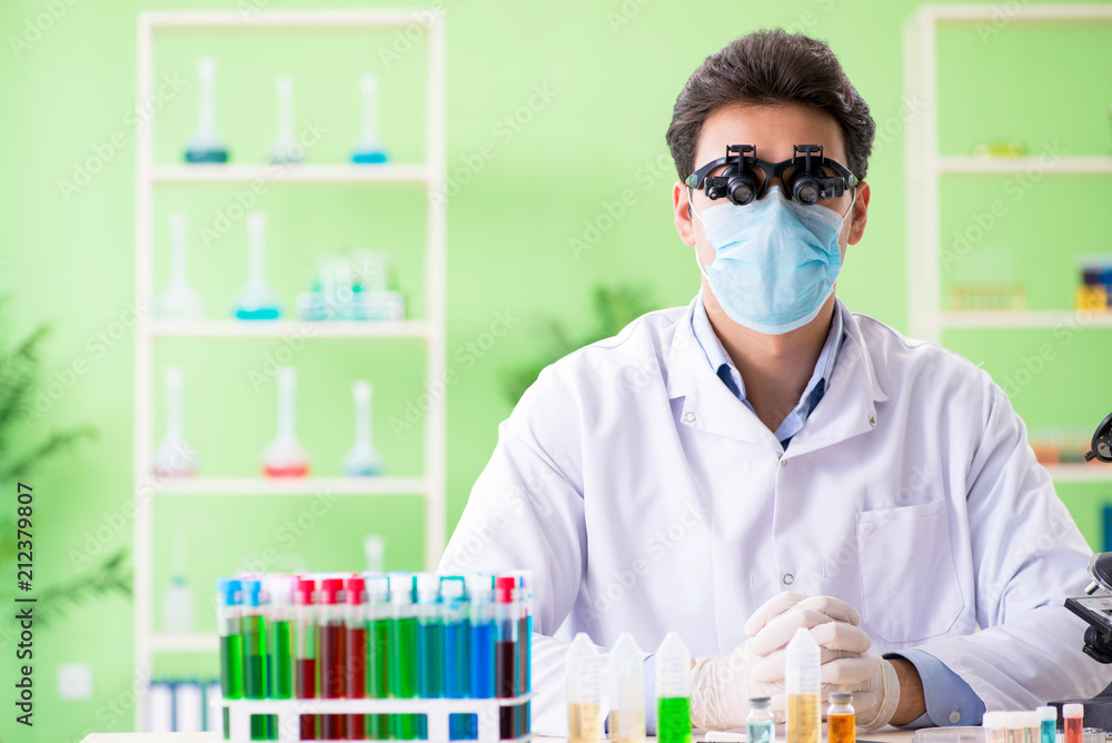 Man chemist working in the lab Man chemist working in the lab