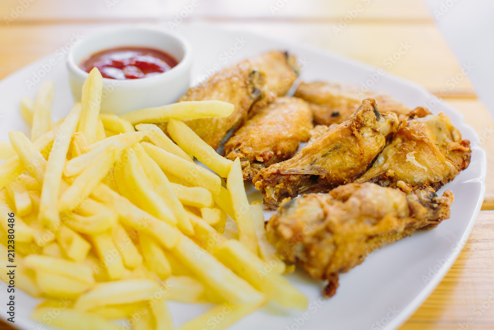 Fried chicken with french fries on the table Fried chicken with french fries on the table